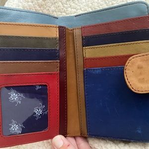Soruka bi-fold multi color wallet with wristlet.  Gently used.